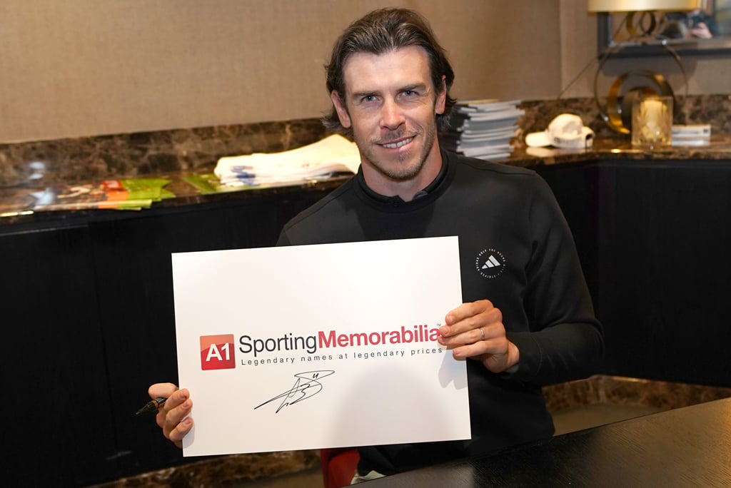 Gareth Bale signs for A1 Sporting Memorabilia on 19th April 2024 in Surrey, UK.