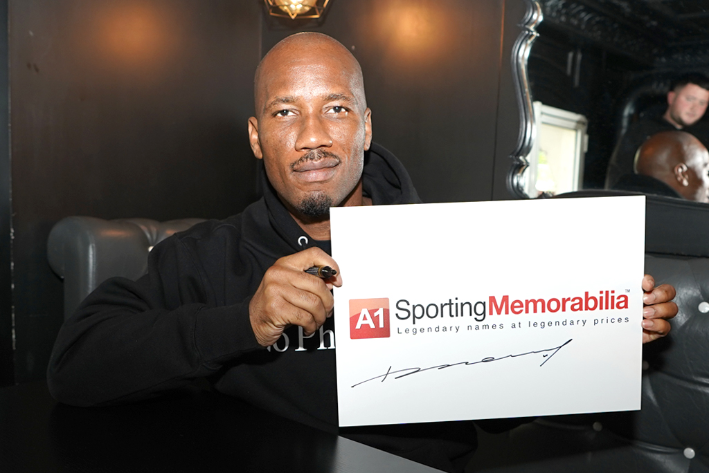 Didier Drogba signs for A1 Sporting Memorabilia on 25th April 2024 in Paris, France.